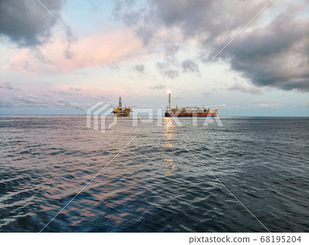 FPSO tanker vessel near Oil Rig platform. Offshore oil and gas industry 68195204