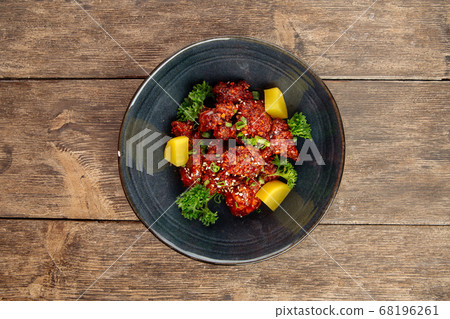 Asian marinated chicken in spicy sauce with daikon Asian marinated chicken in spicy sauce with daikon 68196261