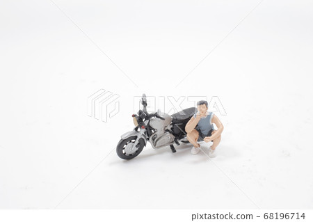a fun of toy figure of smoking. with motorbike a fun of toy figure of smoking. with motorbike 68196714