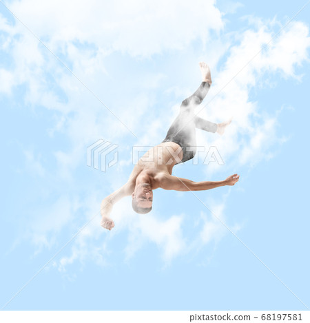 Mid-air beauty. Full length studio shot of attractive young man hovering in air and keeping eyes closed 68197581