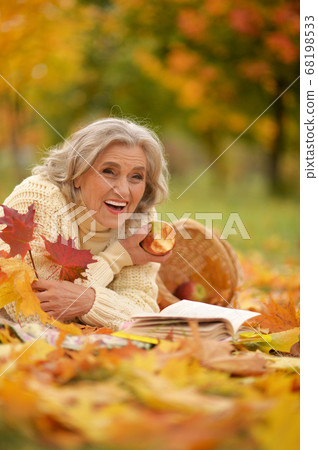 Portrait of senior woman resting in park Portrait of senior woman resting in park 68198533