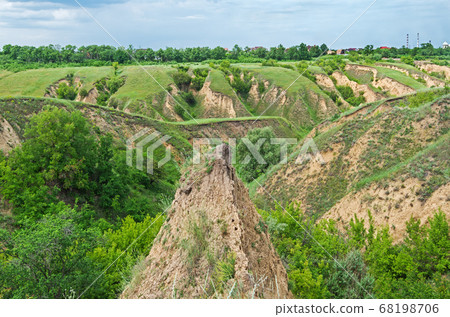 A gully. Erosion of agricultural land A gully. Erosion of agricultural land 68198706