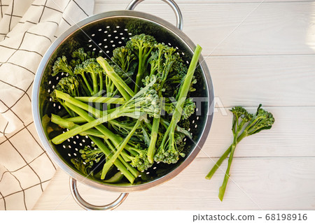 Fresh raw broccolini or baby broccoli top view 68198916