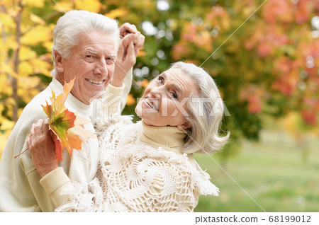 Happy senior couple dancing in summer park 68199012
