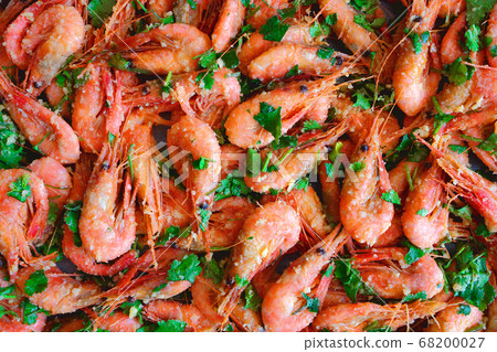 Fresh boiled prawns with coriander. A delicious dish of seafood. Fresh boiled prawns with coriander. A delicious dish of seafood. 68200027