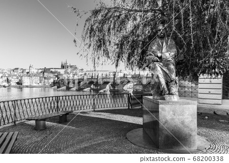 Statue of Bedrich Smetana, Czech composer, at Novotny Foot-bridge. With Vltava River, Charles Bridge and Prague Castle panorama on background. Praha, Czech Republic Statue of Bedrich Smetana, Czech composer, at Novotny Foot-bridge. With Vltava River, Charles Bridge and Prague Castle panorama on background. Praha, Czech Republic 68200338
