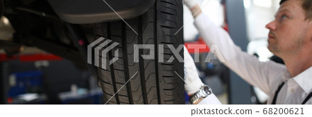 Serious specialist busy with repairing 68200621