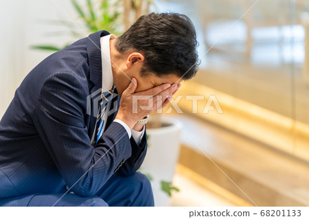 A businessman over the face A businessman over the face 68201133