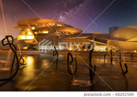 National Museum of Qatar (Desert rose) exterior  night view with fountain in foreground 68201500