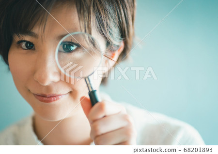 Alasar girls looking through a magnifying glass Alasar girls looking through a magnifying glass 68201893