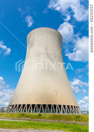 Cooling tower of nuclear power plant. On sunny day with blue sky and white clouds Cooling tower of nuclear power plant. On sunny day with blue sky and white clouds 68202057