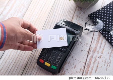 Payment terminal charging from a card, contactless payment. Payment terminal charging from a card, contactless payment. 68202179