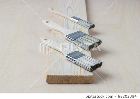 DIY. Brushes on wooden background DIY. Brushes on wooden background 68202384