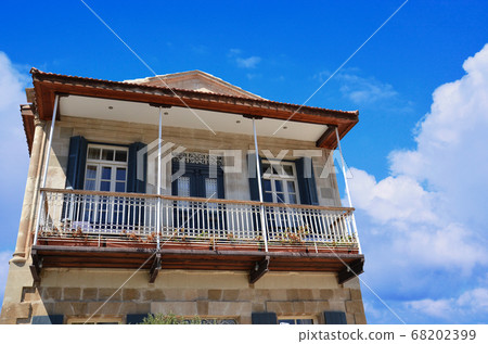 Traditional Cypriot House with Blue Sky in the Background Traditional Cypriot House with Blue Sky in the Background 68202399