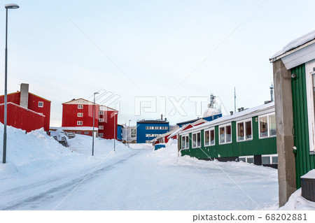 Greenlandic street covered in snow with colorful Greenlandic street covered in snow with colorful 68202881
