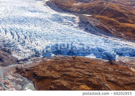Greenlandic ice cap melting glacier with tundra 68202955