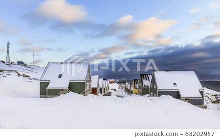 Street full of snow with colorful Inuit houses in Street full of snow with colorful Inuit houses in 68202957