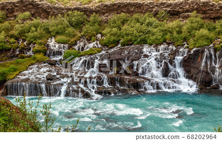 Hraunfossar waterfall powerful streams falling 68202964