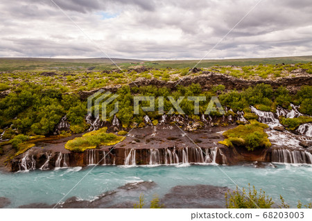 Hraunfossar waterfall streams falling into Hvita 68203003