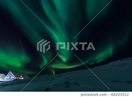 Arctic village and green waves of Northern lights Arctic village and green waves of Northern lights 68203012