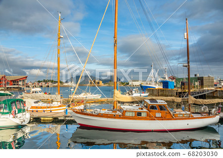 Yachts and boats with mountain in the background Yachts and boats with mountain in the background 68203030