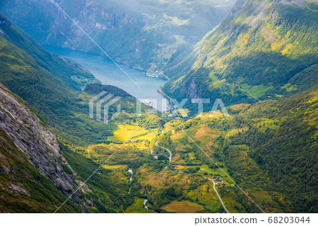 View to the Geiranger fjord with green valley 68203044