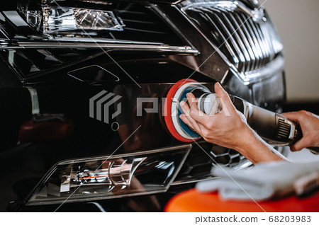 Professional detailing of a modern car, varnish polishing lacquer, cleaning car Professional detailing of a modern car, varnish polishing lacquer, cleaning car 68203983