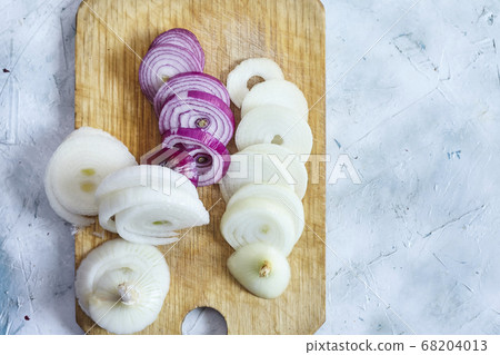 Cutting organic onions. Preparing salad Cutting organic onions. Preparing salad 68204013