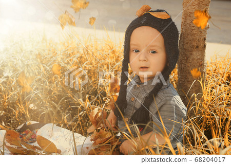 Portrait of 2-3 years old child in autumn garden Portrait of 2-3 years old child in autumn garden 68204017