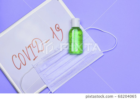 Antiseptic gel and face mask with covid-19 inscription Antiseptic gel and face mask with covid-19 inscription 68204065