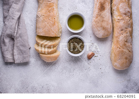 Homemade French baguettes with olive oil Homemade French baguettes with olive oil 68204091