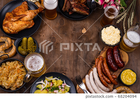 Oktoberfest dishes with beer, pretzel and sausage Oktoberfest dishes with beer, pretzel and sausage 68204094
