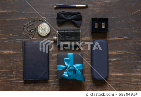 Men's accessories, bow tie, pocket watch on chain and others and gift box with blue ribbon, top Men's accessories, bow tie, pocket watch on chain and others and gift box with blue ribbon, top 68204914
