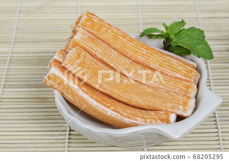 Imitation Crab Stick in bowl with green leaf. Imitation Crab Stick in bowl with green leaf. 68205295