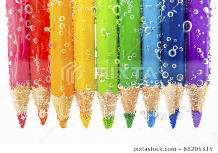 Colorful pencils in water with bubbles. Colorful pencils in water with bubbles. 68205315