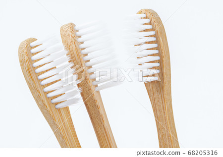 Bamboo toothbrush on white. Bamboo toothbrush on white. 68205316
