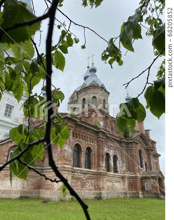 Facade of old brick church tower. Chapel, architecture. Facade of old brick church tower. Chapel, architecture. 68205852