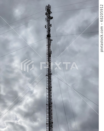 cell tower against a gloomy sky cell tower against a gloomy sky 68205912