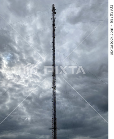 cell tower against a gloomy sky 68205932
