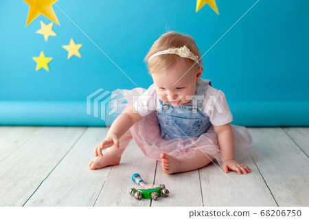 First baby birthday. Girl touches a star. 68206750