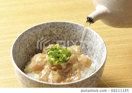 Pour dashi into rice with sea bream dipped in sea bream chazuke and sesame miso sauce 68211185