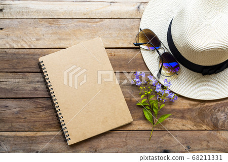 notebook ,sunglasses ,hat and purple flowers of lifestyle woman relax in summer season notebook ,sunglasses ,hat and purple flowers of lifestyle woman relax in summer season 68211331