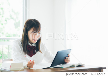 High school students studying while looking at a tablet 68212714