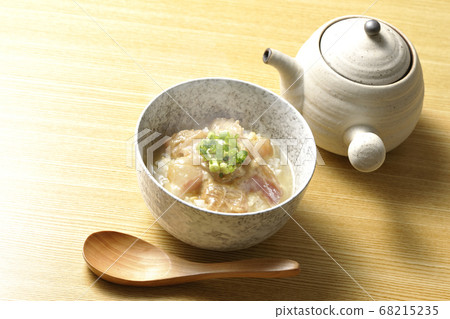 Hot red sea bream pickled in sesame miso sauce, wooden spoon and teapot 68215235