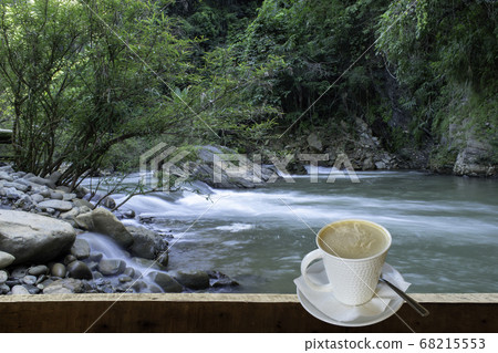 Isolated Hot coffee Put a glass of white with a casual break from work background waterfall Isolated Hot coffee Put a glass of white with a casual break from work background waterfall 68215553