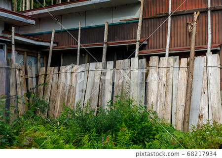 House surrounded by wooden boards, winter enclosure, Tohoku region House surrounded by wooden boards, winter enclosure, Tohoku region 68217934