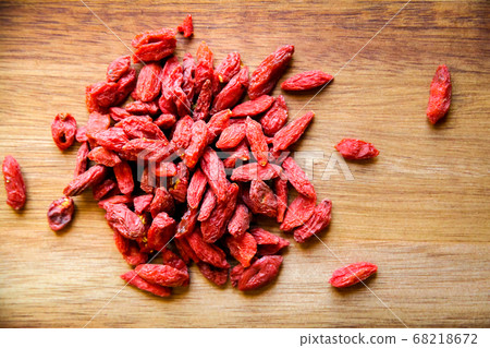 Goji berries on a cutting board Goji berries on a cutting board 68218672