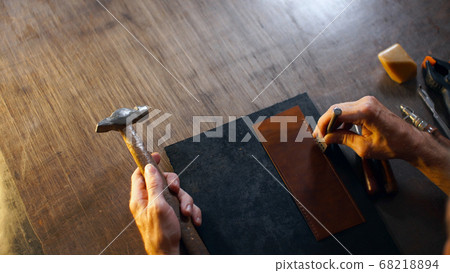 Male hand performs work with tools. Male hand performs work with tools. 68218894