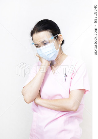 Medical personnel wearing face shields and masks 68219340