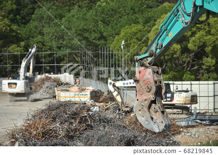Demolition site Scene of sorting rubble with large heavy equipment Demolition site Scene of sorting rubble with large heavy equipment 68219845